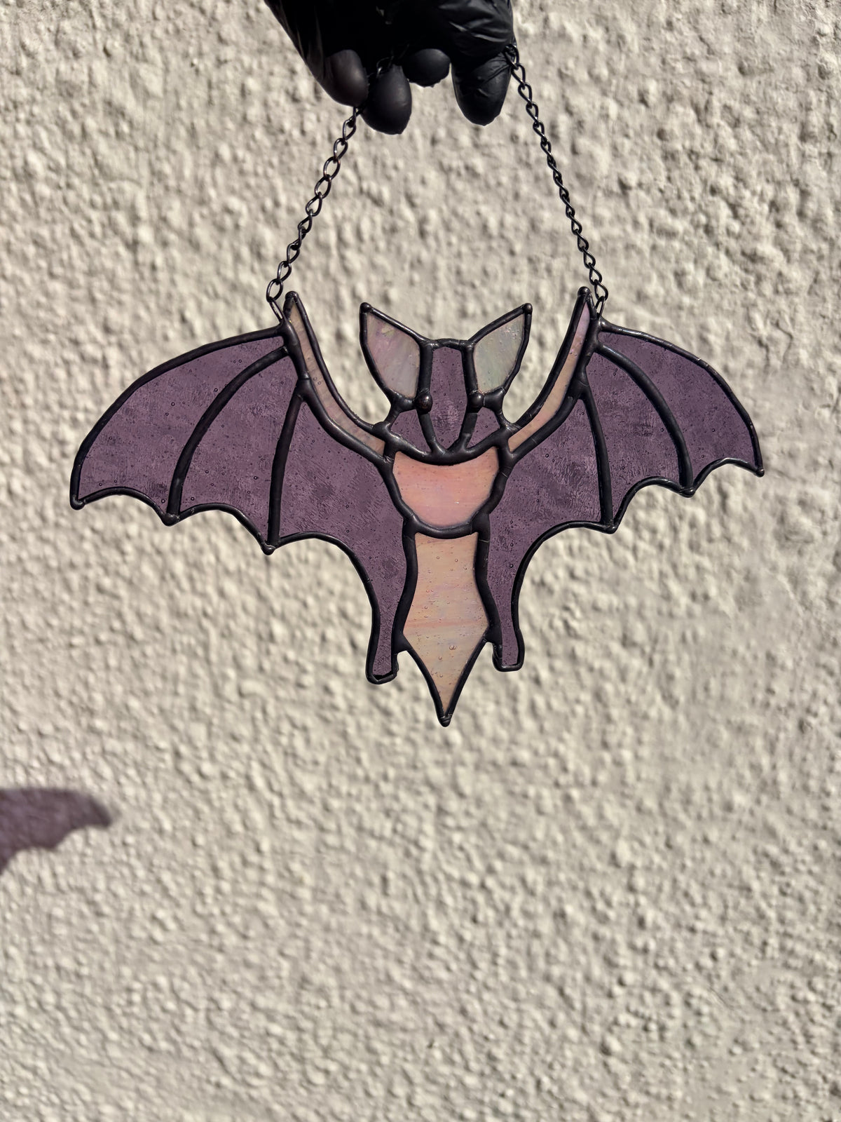 Intricate stained glass bats