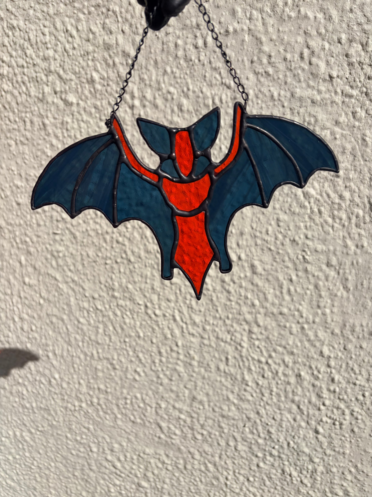 Intricate stained glass bats