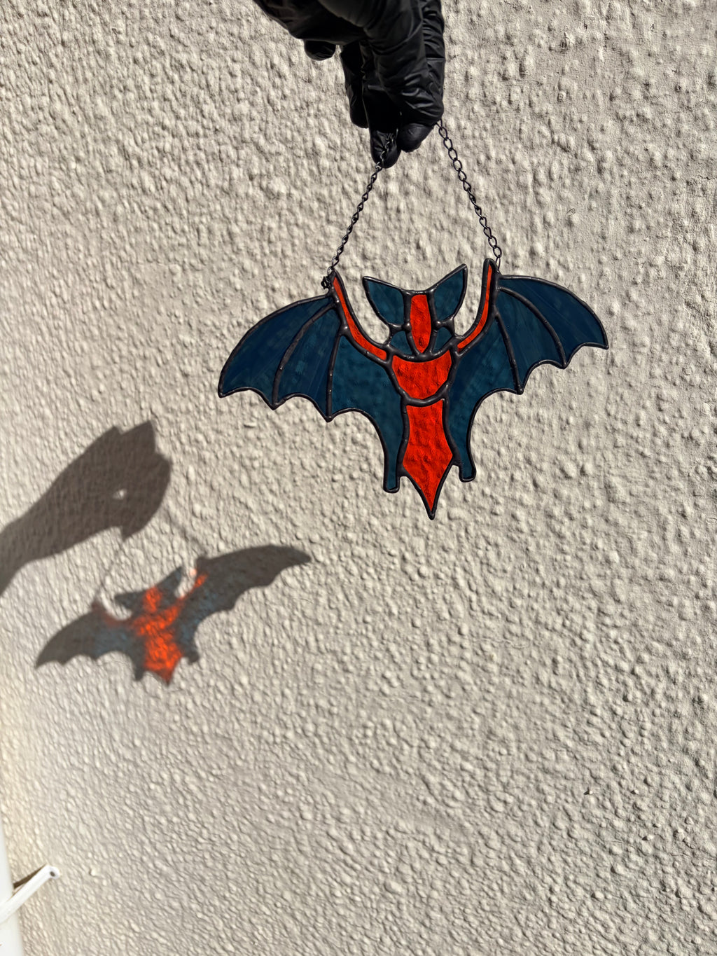 Intricate stained glass bats