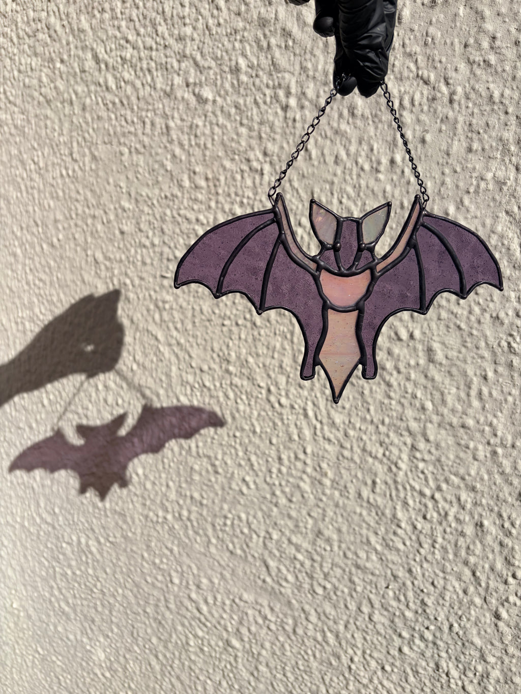 Intricate stained glass bats