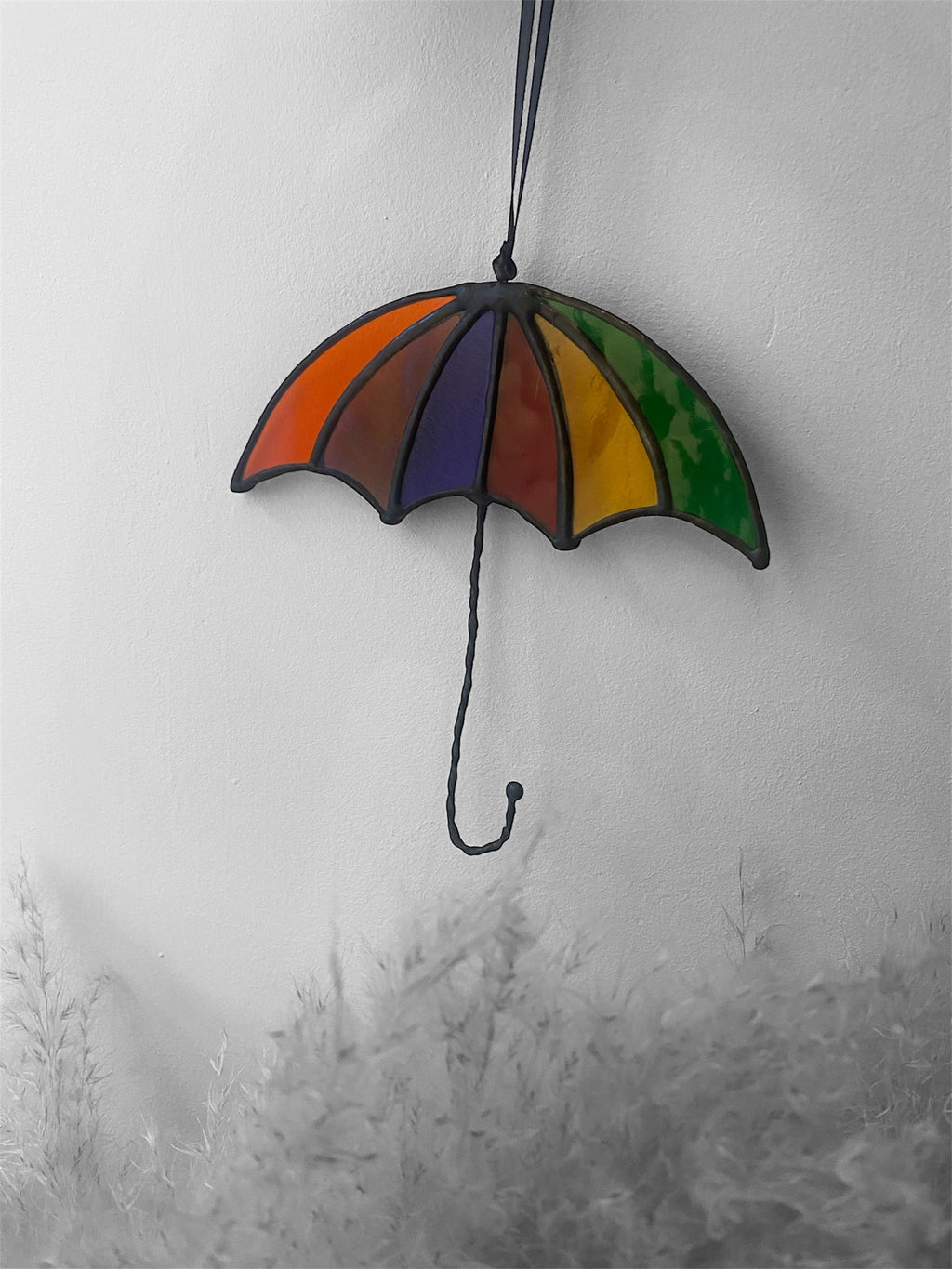 Stained glass umbrella decoration on a white background