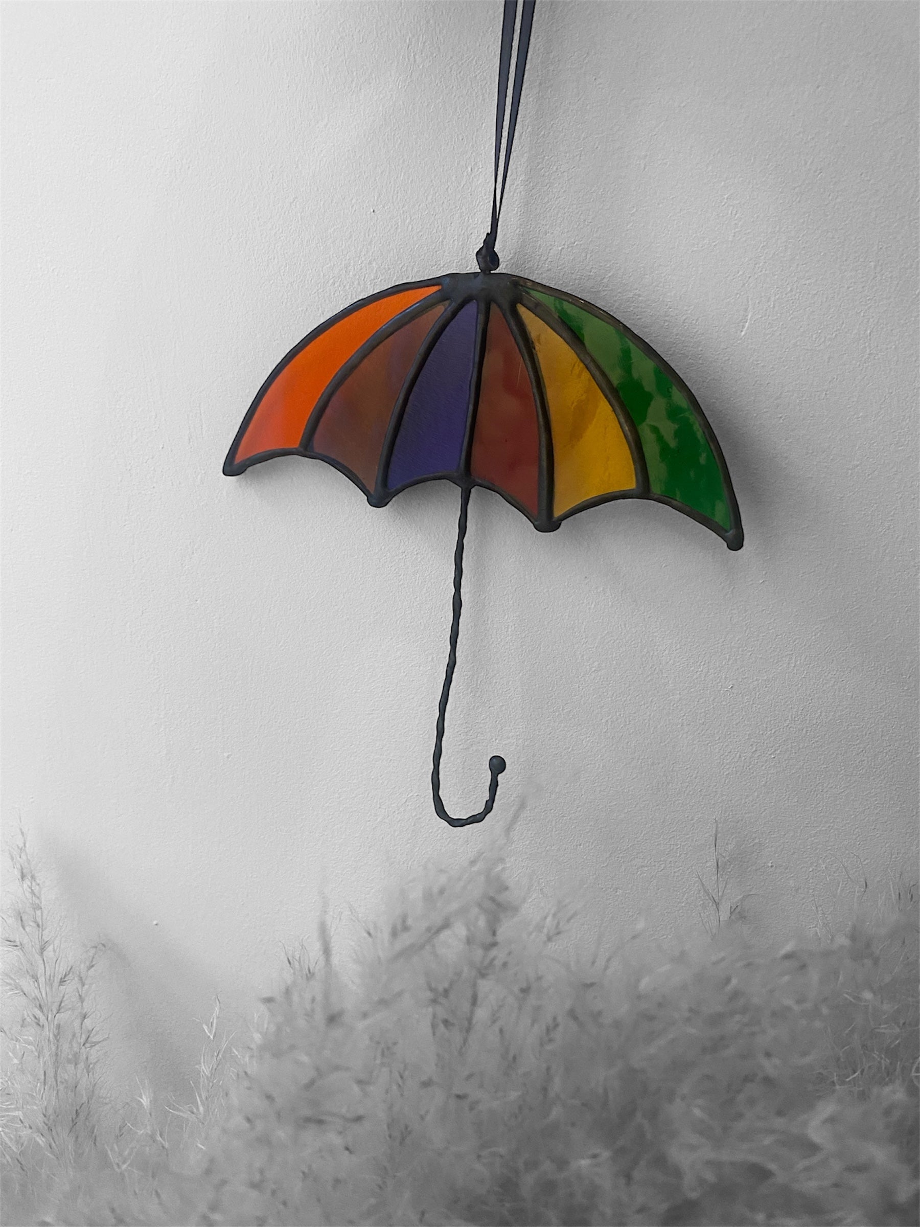 Stained glass umbrella decoration on a white background