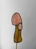 pink stained glass mushroom on a metal stake to decorate house plants