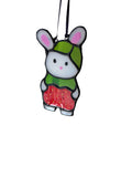 Stylized cartoon character with a green hat and red outfit on a white background