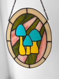 Stained glass panel with colorful mushrooms on a white background